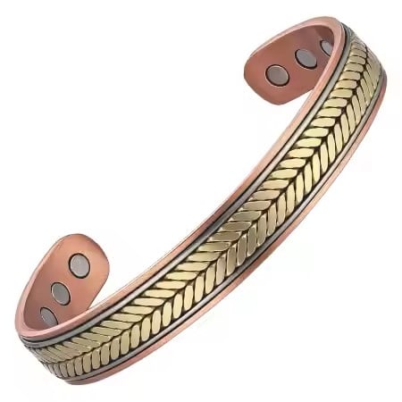 A patterned magnetic copper therapy bracelet, Featuring an adjustable open-cuff design with a detailed herringbone texture down the center flanked by gold and silver-toned accents, displaying high-strength therapy magnets on the inner copper band.