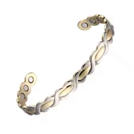 A patterned magnetic copper therapy bracelet. Featuring an adjustable open-cuff design with a detailed herringbone texture down the center flanked by gold and silver-toned accents, displaying high-strength therapy magnets on the inner copper band.