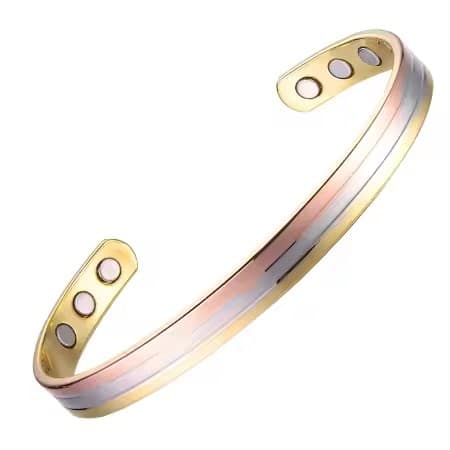 A three-tone magnetic copper therapy bracelet,. Featuring an adjustable open-cuff design with elegant parallel stripes of gold, rose gold, and silver, displaying high-strength therapy magnets on the polished inner copper band.